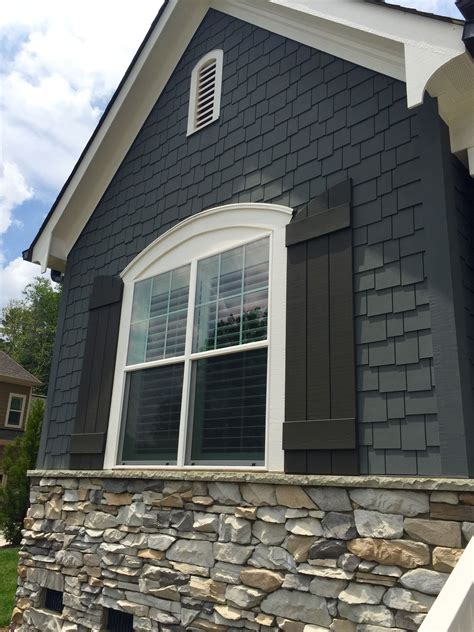 metal roofs on gray house|grey houses with black shutters.